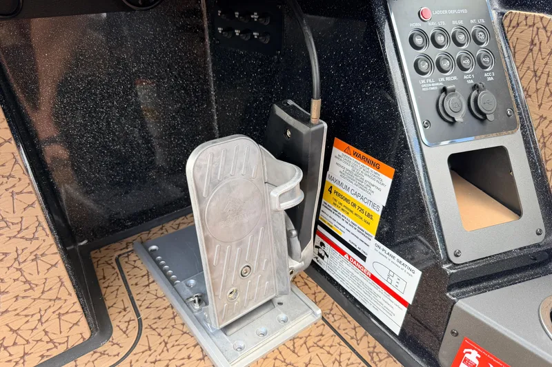 Slide: The Image of Control panel and foot pedal in 2026 Vexus VXs21 boat cockpit. - 16