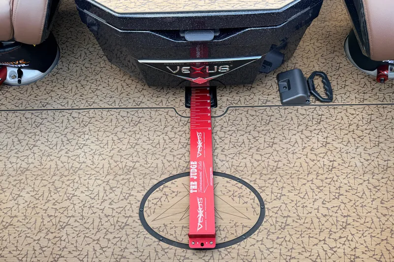 Slide: The Image of 2026 Vexus VXs21 boat deck with measuring tool and textured flooring. - 21