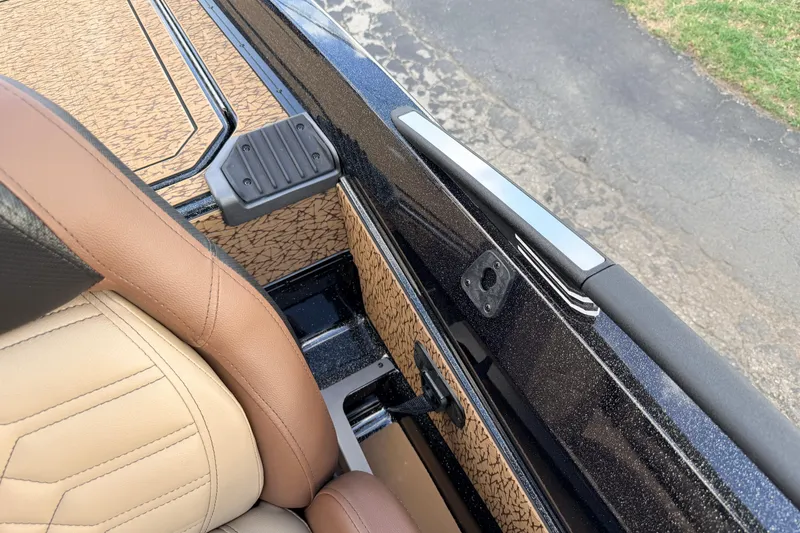 Slide: The Image of 2026 Vexus VXs21 boat interior with tan leather seats and textured flooring. - 25