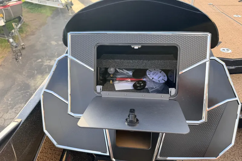 Slide: The Image of 2026 Vexus VXs21 boat dashboard with open storage compartment, showcasing modern design and functionality. - 28