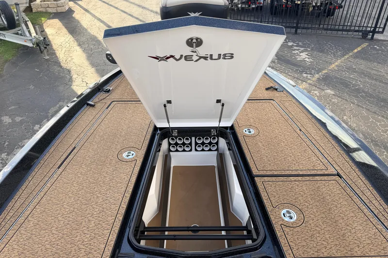 Slide: The Image of 2026 Vexus VXs21 boat storage compartment open, showcasing spacious interior and sleek design. - 30