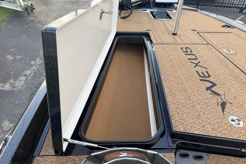 Slide: The Image of 2026 Vexus VXs21 boat storage compartment with open lid, showcasing spacious interior. - 31