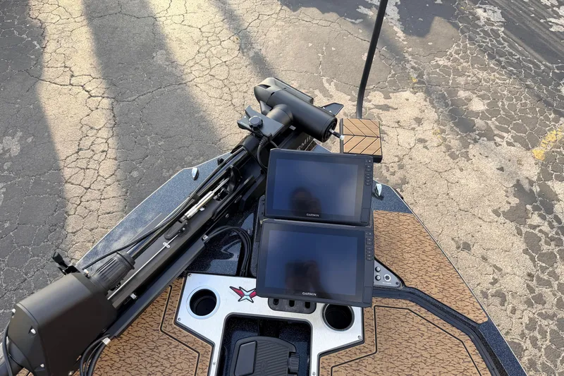 Slide: The Image of 2026 Vexus VXs21 boat dashboard with dual Garmin screens and advanced controls. - 37