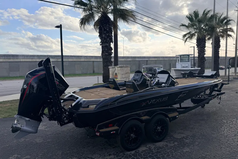 Slide: The Image of 2026 Vexus VXs21 boat parked outdoors, featuring sleek design and powerful engine. - 4