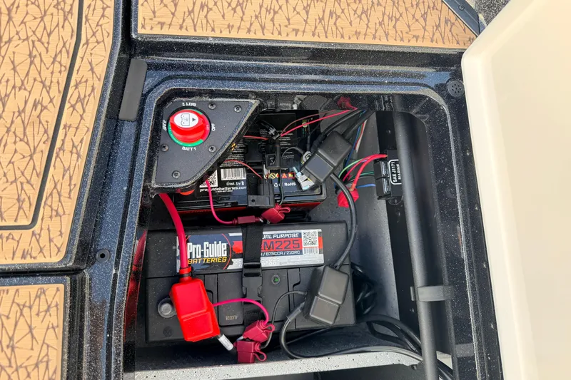 Slide: The Image of 2026 Vexus VXs21 battery compartment with Pro-Guide battery and wiring setup. - 45