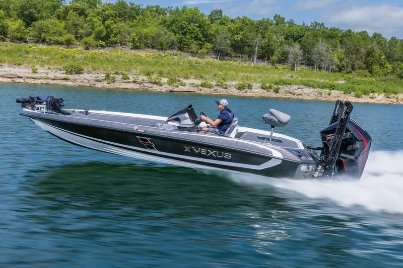 Slide: The Image of Manufacturer Provided Image: 2026 Vexus VXs21 boat speeding on a lake with lush green shoreline. - 48