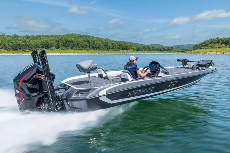 Slide: The Image of Manufacturer Provided Image: 2026 Vexus VXs21 boat speeding on a lake with lush green shoreline. - 49