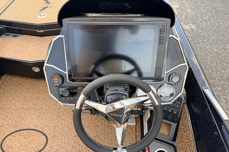 Slide: The Image of 2026 Vexus VXs21 boat dashboard with steering wheel and digital display. - 9