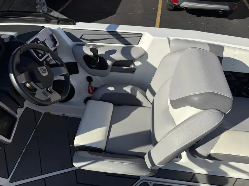 Slide: The Image of Interior of 2022 Malibu Wakesetter 21 LX with steering wheel and seat. - 12
