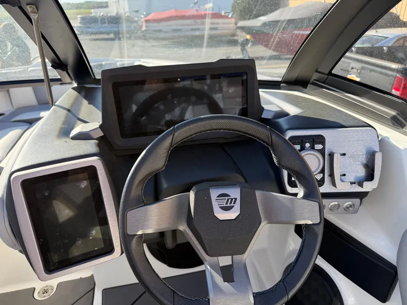 Slide: The Image of Interior view of 2022 Malibu Wakesetter 21 LX helm. - 14