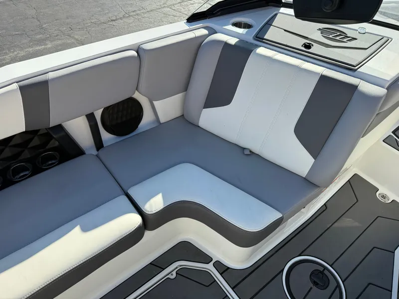 Slide: The Image of Interior of 2022 Malibu Wakesetter 21 LX with gray and white seating. - 16