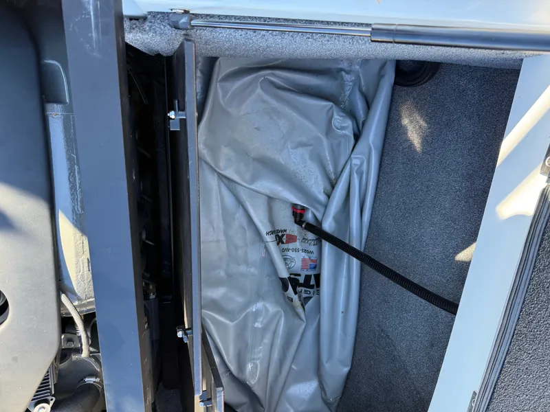 Slide: The Image of Interior view of 2022 Malibu Wakesetter 21 LX storage compartment. - 17