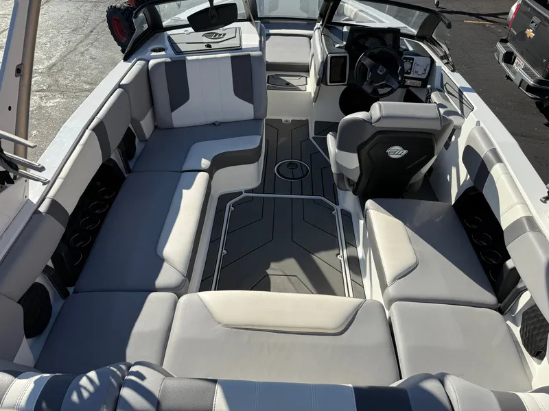 Slide: The Image of Interior of 2022 Malibu Wakesetter 21 LX with gray upholstery. - 18