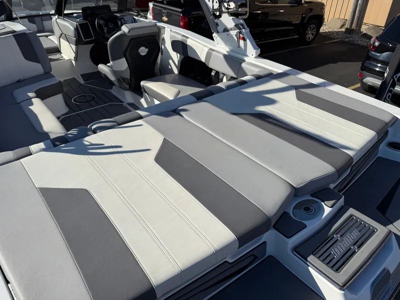 Slide: The Image of Interior of 2022 Malibu Wakesetter 21 LX with luxurious seating. - 23