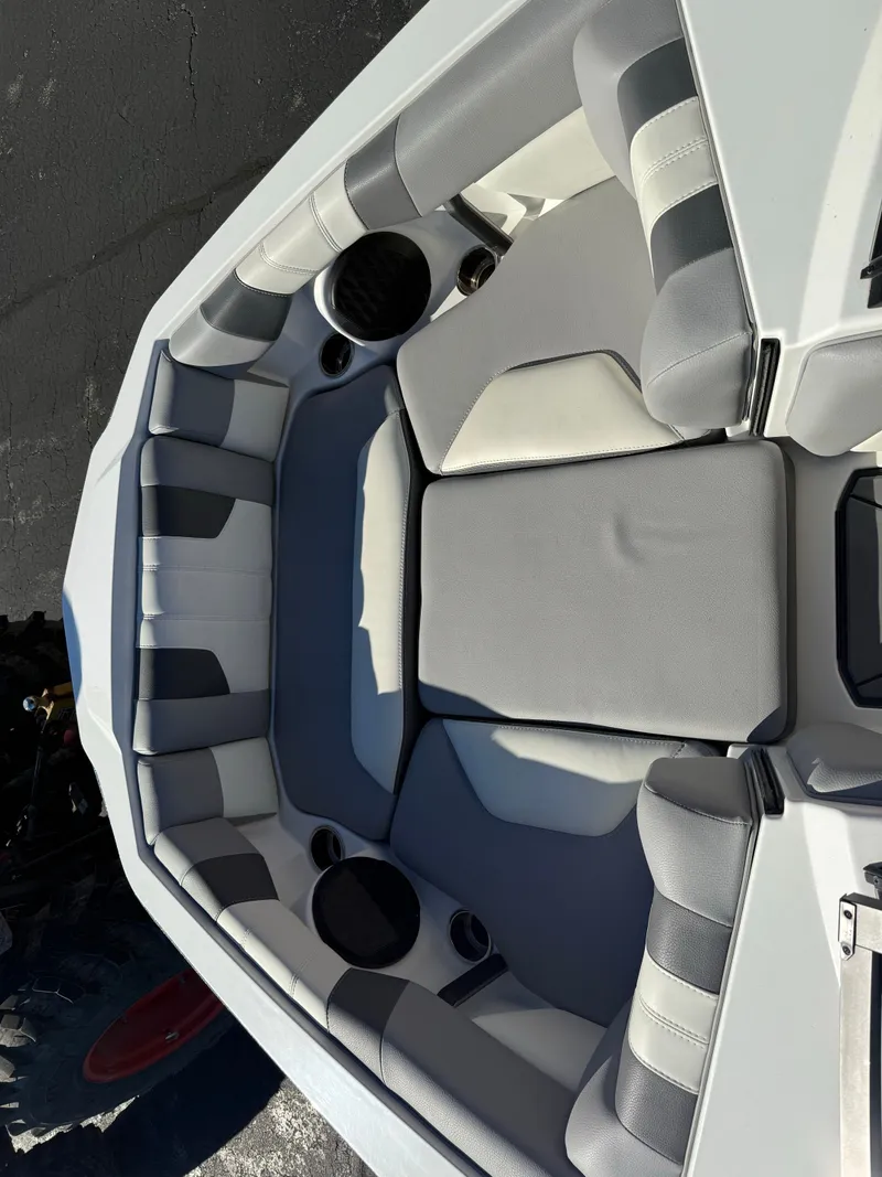 Slide: The Image of Interior of 2022 Malibu Wakesetter 21 LX with gray upholstery. - 6