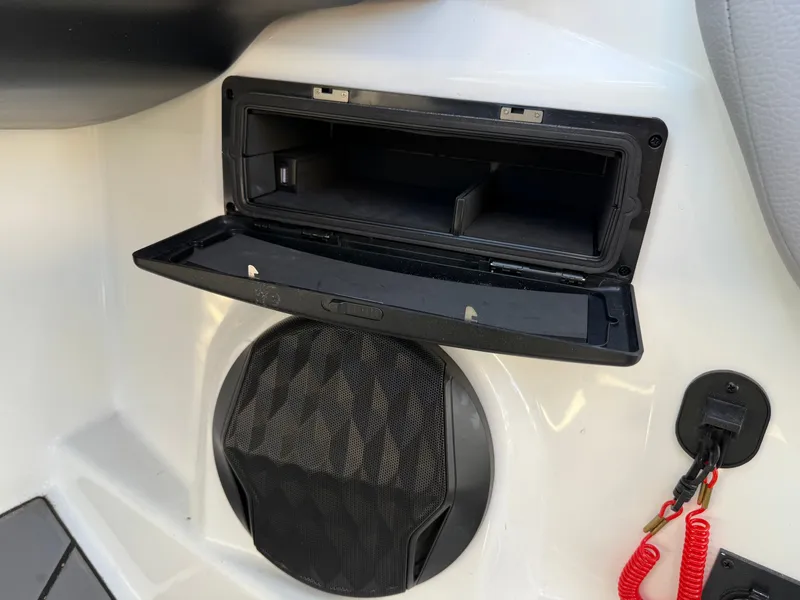 Slide: The Image of 2022 Malibu Wakesetter 21 LX speaker and storage compartment. - 7
