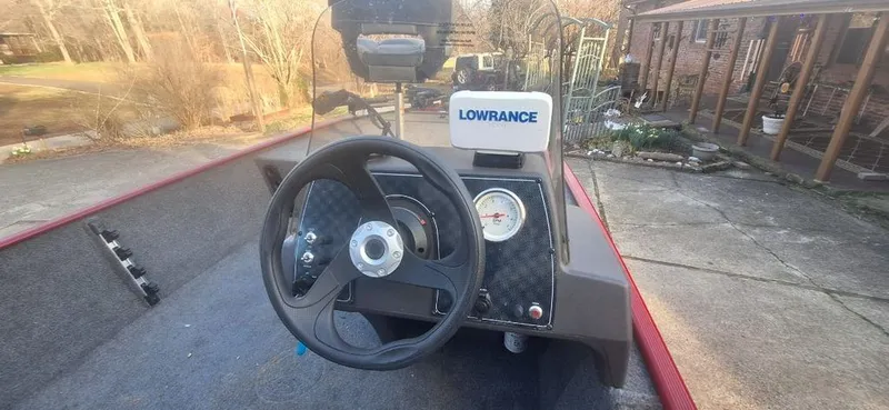 Slide: The Image of 2024 Tracker Bass Tracker Classic XL steering console with Lowrance device. - 3