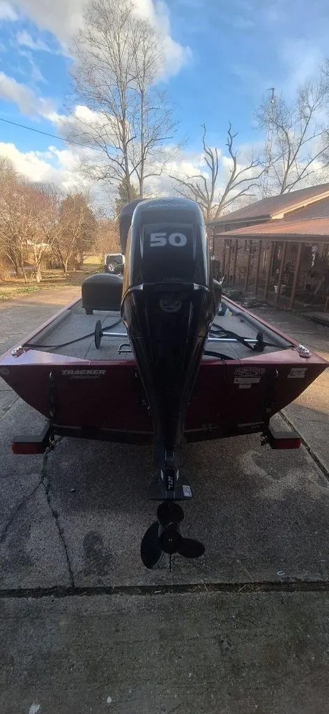 Slide: The Image of 2024 Tracker Bass Tracker Classic XL boat with outboard motor. - 9