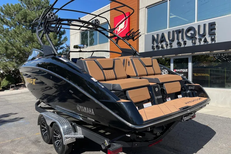 Slide: The Image of 2026 Yamaha Boats 255XD displayed at Nautique dealership, featuring sleek design and luxurious seating. - 3