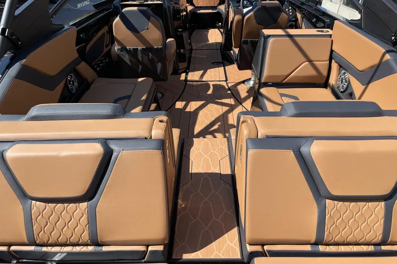 Slide: The Image of 2026 Yamaha Boats 255XD interior with tan and black seating, modern design. - 4