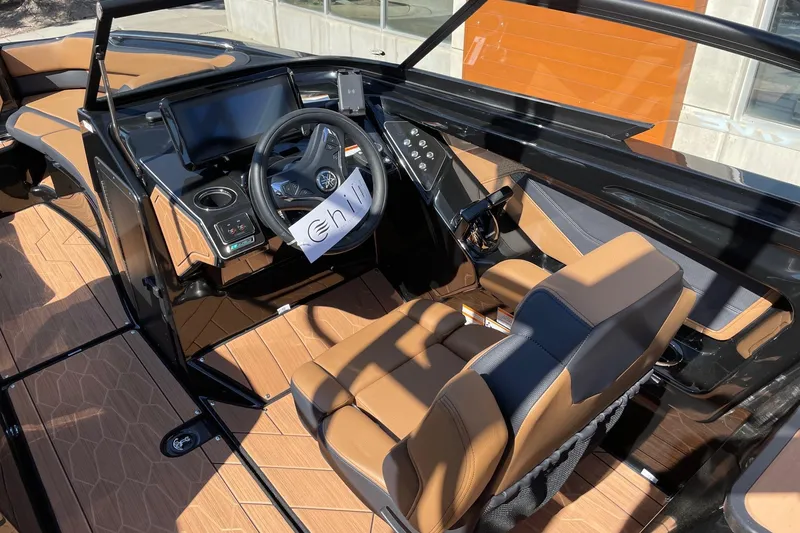 Slide: The Image of 2026 Yamaha Boats 255XD cockpit with modern controls and luxurious seating. - 6