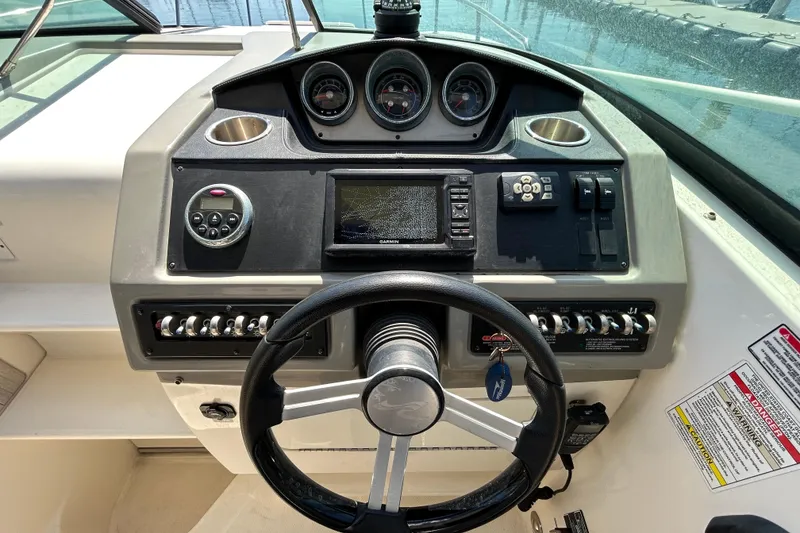 Slide: The Image of 2014 Sea Ray Sundancer 260 boat on trailer, viewed from below. - 17