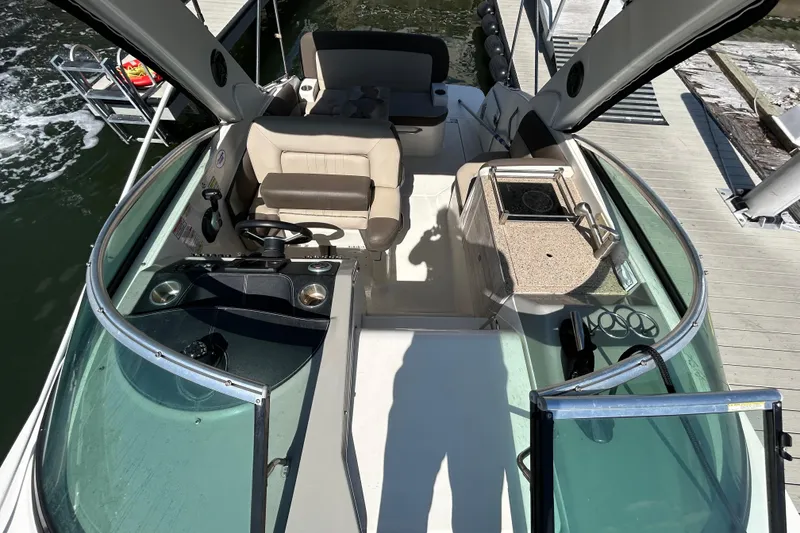 Slide: The Image of Cockpit view of 2014 Sea Ray Sundancer 260 boat with steering wheel and control panel. - 30