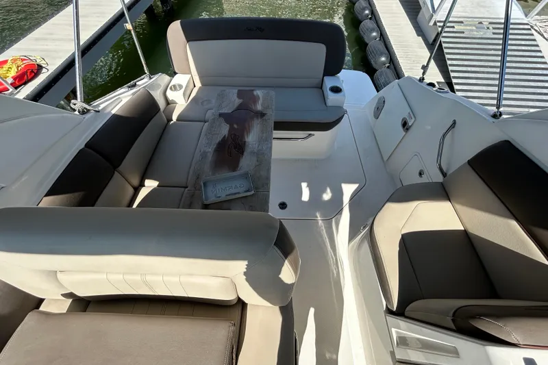 Slide: The Image of Control panel of a 2014 Sea Ray Sundancer 260 boat with capacity warning labels. - 32