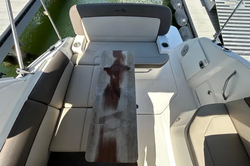 Slide: The Image of 2014 Sea Ray Sundancer 260 helm with steering wheel and instrument panel. - 33