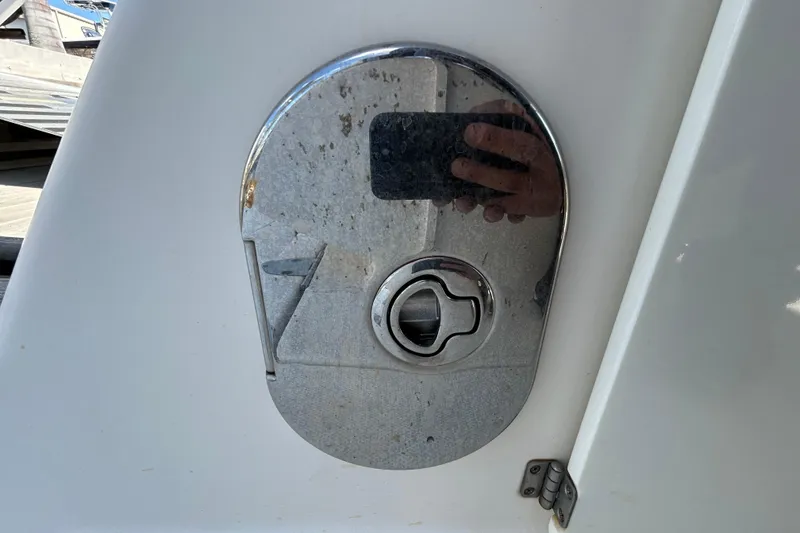 Slide: The Image of Control panel of a 2014 Sea Ray Sundancer 260 boat with warning labels and switches. - 37