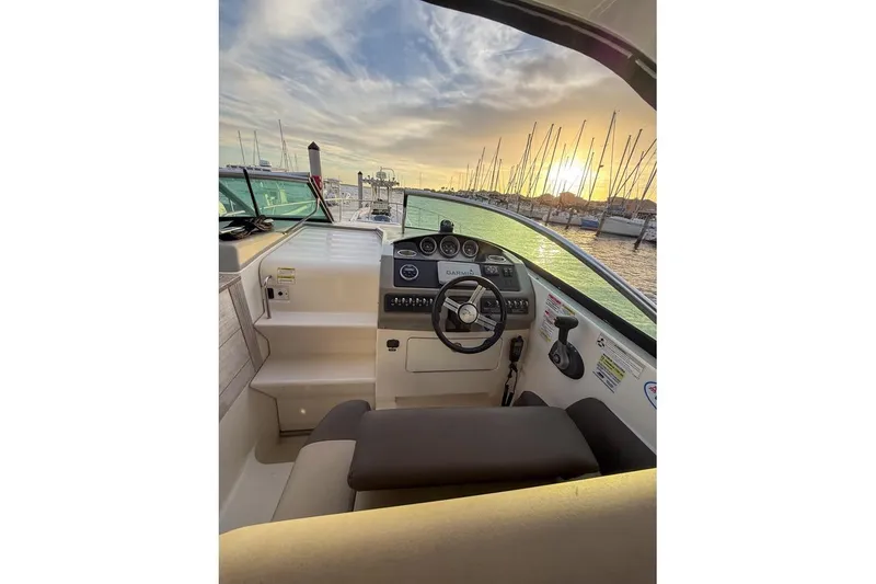 Slide: The Image of 2014 Sea Ray Sundancer 260 helm with sunset marina view. - 4