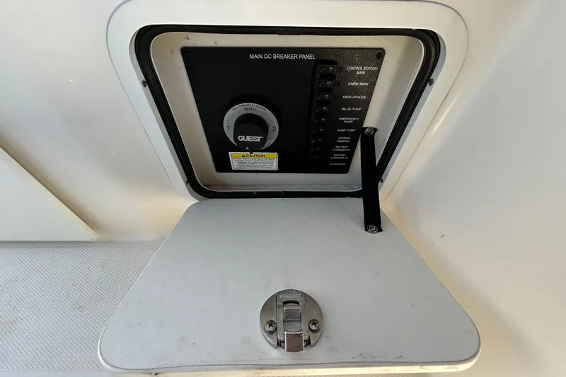 Slide: The Image of 2014 Sea Ray Sundancer 260 cockpit with helm, gauges, and cabin entrance. - 43