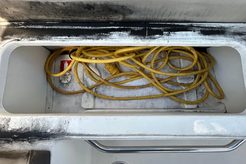 Slide: The Image of Interior view of 2014 Sea Ray Sundancer 260 boat cockpit with dashboard and steps. - 47