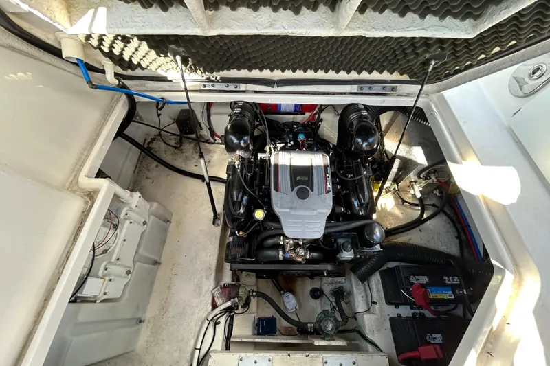 Slide: The Image of Interior of 2014 Sea Ray Sundancer 260 boat with kitchenette and seating area. - 49