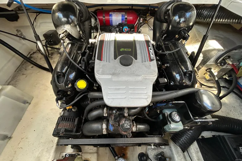 Slide: The Image of Interior of 2014 Sea Ray Sundancer 260 boat with kitchenette and seating area. - 50