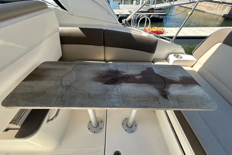 Slide: The Image of Interior of 2014 Sea Ray Sundancer 260 with kitchenette sink and countertop. - 52