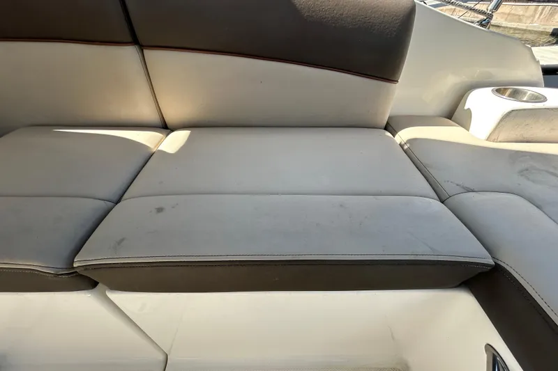 Slide: The Image of Microwave inside 2014 Sea Ray Sundancer 260 boat, featuring wood cabinetry and digital controls. - 54