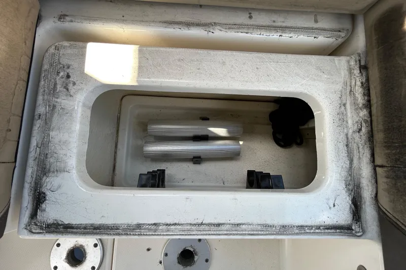 Slide: The Image of 2014 Sea Ray Sundancer 260 cabin interior with seating and natural light. - 56