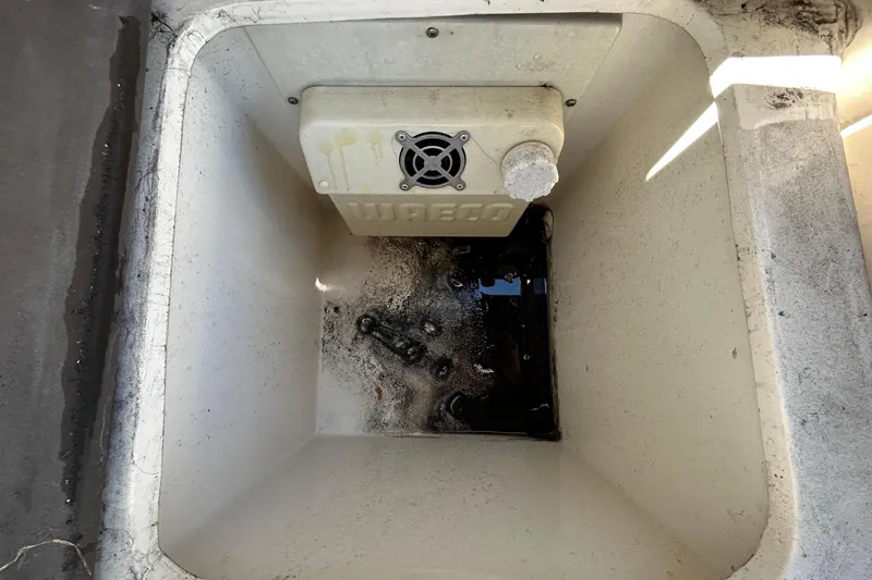 Slide: The Image of Interior view of 2014 Sea Ray Sundancer 260 cabin with skylight and wooden accents. - 59