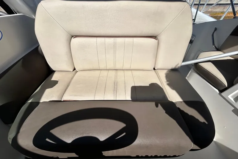 Slide: The Image of Interior of 2014 Sea Ray Sundancer 260 with damaged upholstery and sunlight streaming through window. - 61