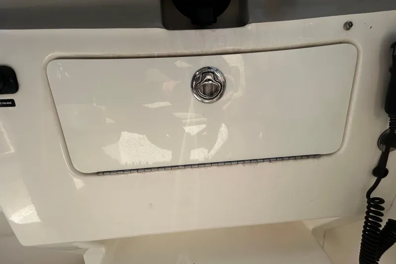 Slide: The Image of Interior of 2014 Sea Ray Sundancer 260, featuring cozy seating and modern kitchenette. - 62