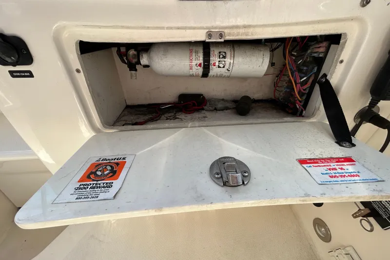 Slide: The Image of Interior of 2014 Sea Ray Sundancer 260 with kitchenette and seating area. - 63