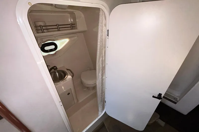 Slide: The Image of Rear seating area of a 2014 Sea Ray Sundancer 260 boat with cup holders. - 80