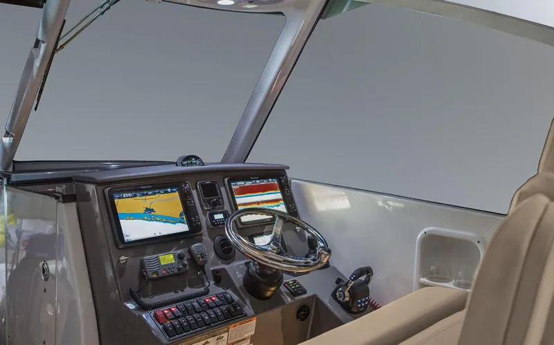 Slide: The Image of Manufacturer Provided Image: 2018 Pursuit DC 325 Dual Console boat helm with navigation screens and controls. - 5