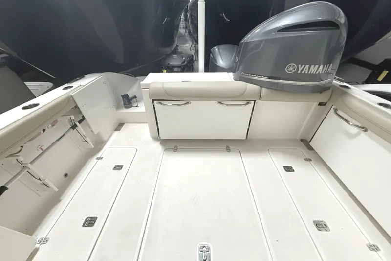 Slide: The Image of 2018 Pursuit DC 325 Dual Console boat interior with Yamaha engine, spacious deck layout. - 9