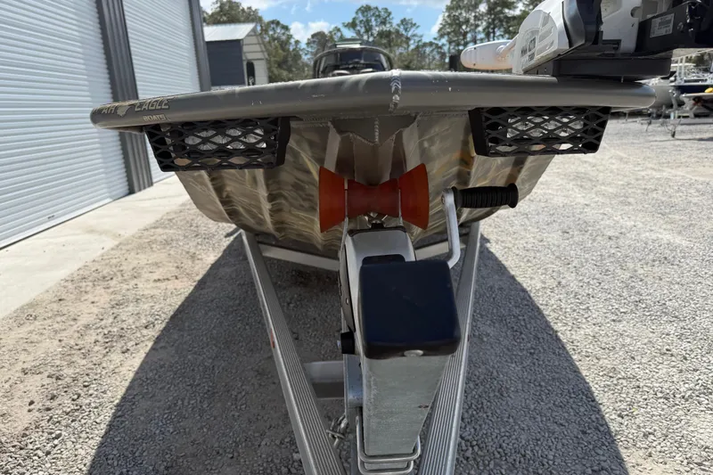 Slide: The Image of 2022 War Eagle 2170 Blackhawk boat on trailer, front view in outdoor setting. - 15