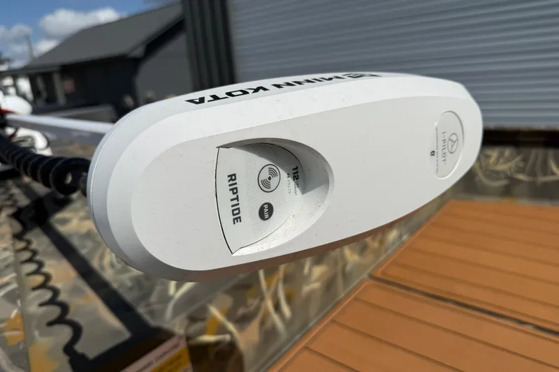 Slide: The Image of Minn Kota Riptide motor on 2022 War Eagle 2170 Blackhawk boat, close-up view. - 17