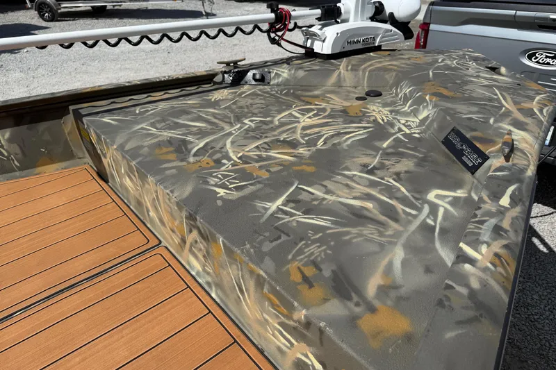 Slide: The Image of 2022 War Eagle 2170 Blackhawk boat with camouflage design and Minn Kota trolling motor. - 18
