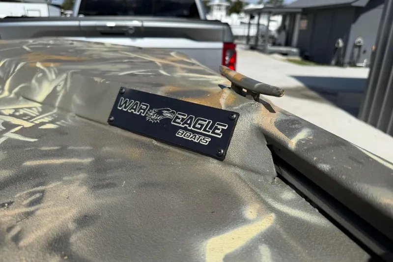 Slide: The Image of 2022 War Eagle 2170 Blackhawk boat with camouflage design and logo plate. - 19