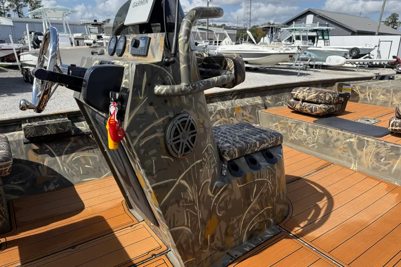 Slide: The Image of 2022 War Eagle 2170 Blackhawk boat with camo design and Garmin navigation system. - 29
